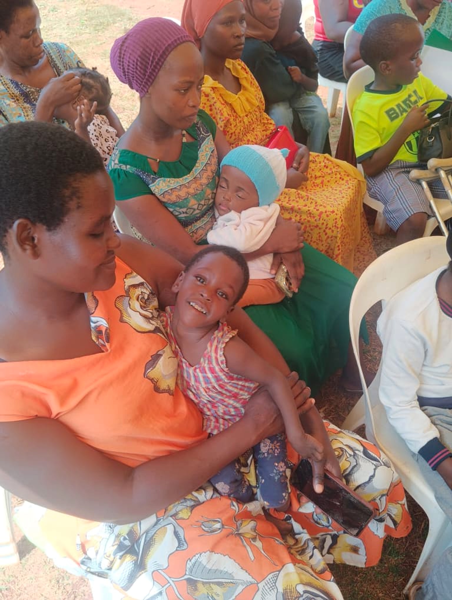Children and their caregivers seated together during the St. Jude Africa gathering
