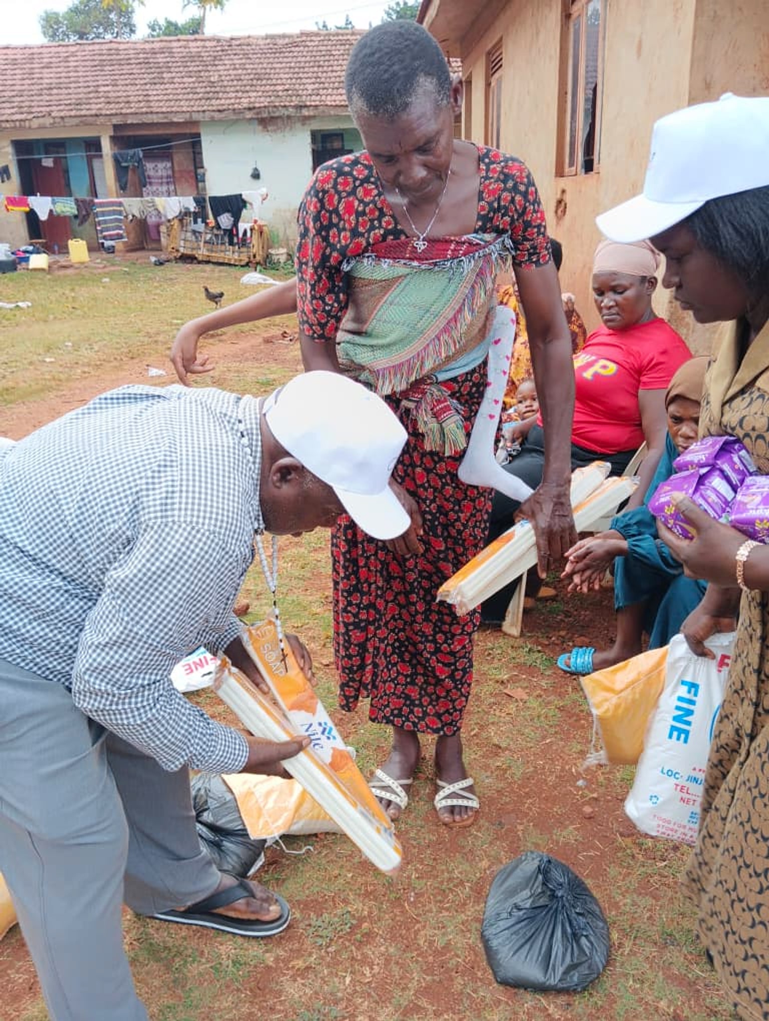 The foundation team sharing household essentials with families outside the office